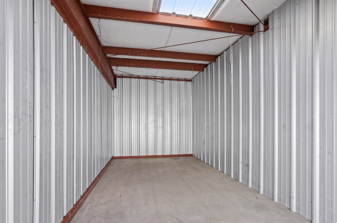 Spacious empty storage unit with skylight panel